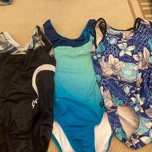 Plum and GK gymnastics leotards